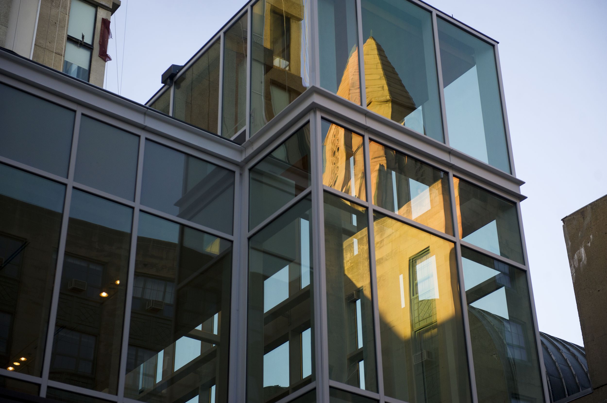  CAS reflects in the glass of the new The Sumner M. Redstone building in the evening light September 3, 2014. &nbsp;Photo by Cydney Scott for Boston University Photography 