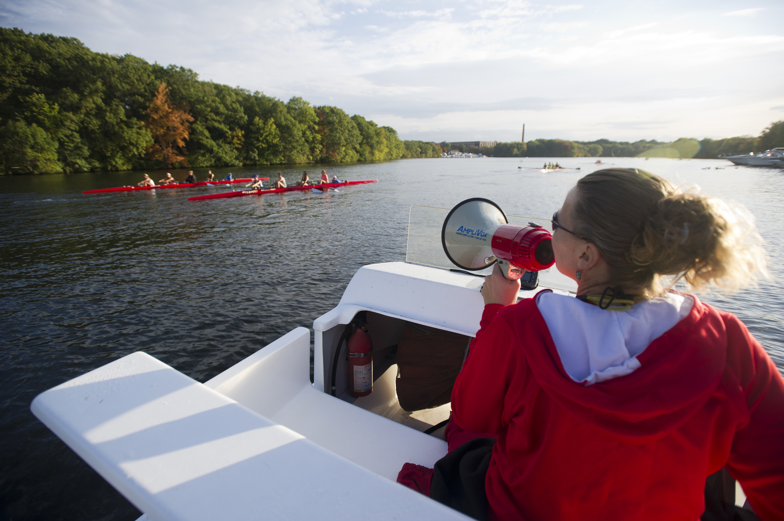  The BU Women's Crew Team coach Stacey Rippetoe does her thing on the Charles during an early morning practice October 7, 2014. &nbsp;Photo by Cydney Scott for Boston University Photography 