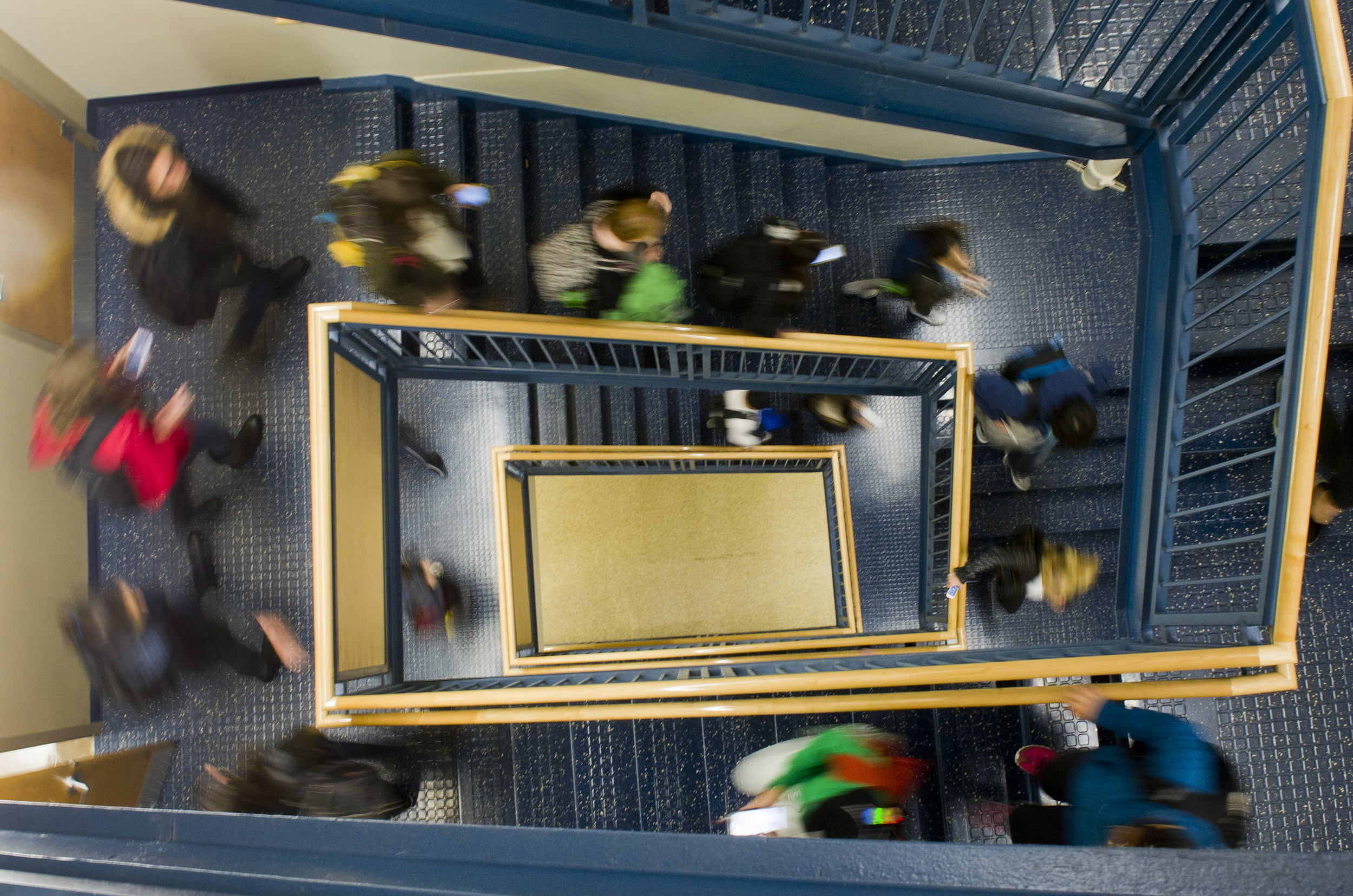  Students hit the stairs between classes at CGS November 6, 2014.&nbsp;Photo by Cydney Scott for Boston University Photography 