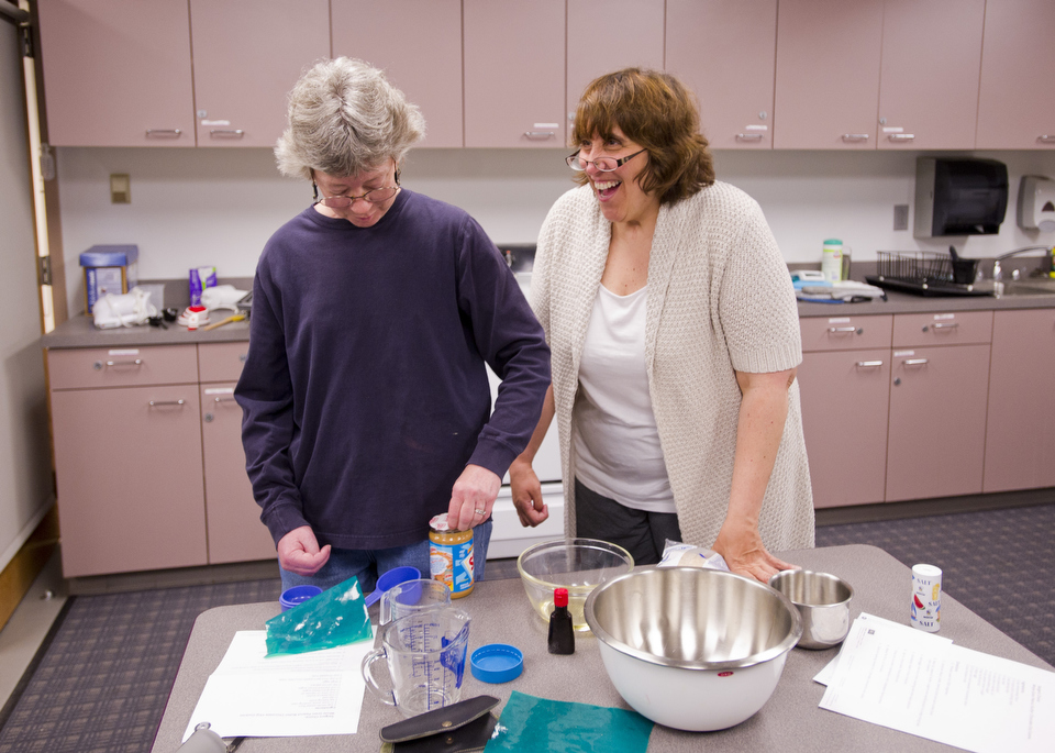  Pat Dennis of Concord, left, and Mary Borrelli of Lynn manage to retain their sense of humor even when OT sessions get frustrating. This is for a story about a summer program for Aphasia patients at Aphasia Resource Center at SAR. &nbsp;Photo by Cyd
