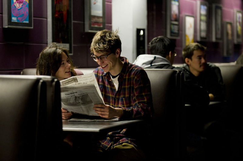  Chelsea Towson (CAS,'12) and her boyfriend Peter Szujewski (CAS,'12) look over a copy of The Boston Globe together while taking a break between classes at BU Central during the first day back to classes Tuesday, January 17, 2012.&nbsp;  Photo by Cyd