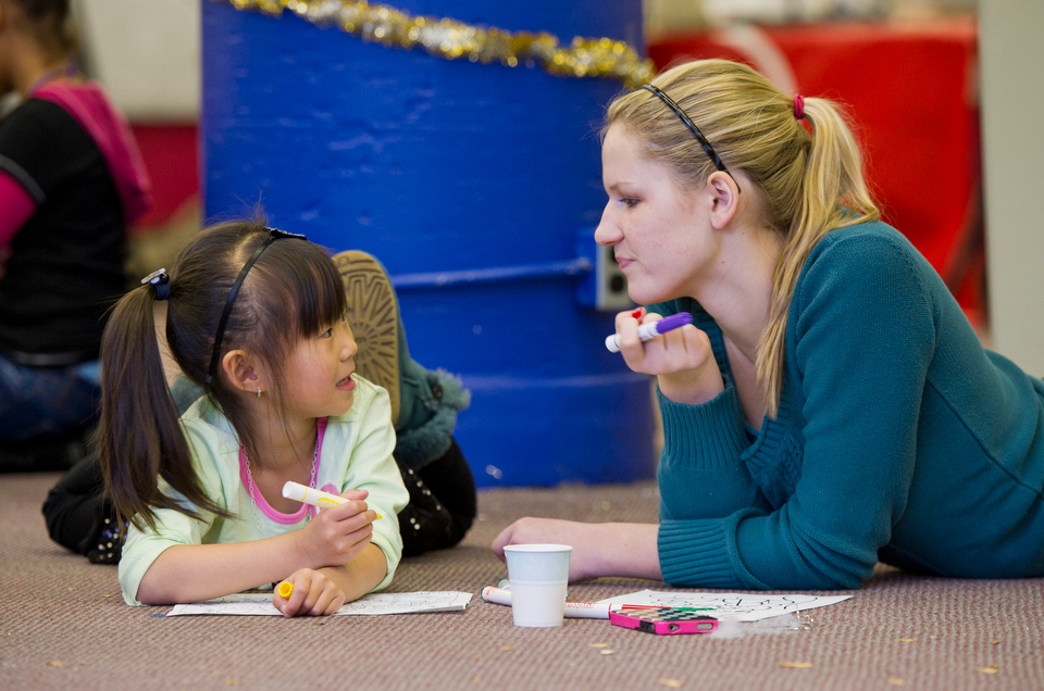  Hannah Lee (CGS'16) left, colors with her "little sister" Olivia Wong, 5, during the Career Service Centers' Siblings Winter Wonderland event at 750 Commonwealth Ave. December 8, 2012. The event provided a place for students to hang out with their s