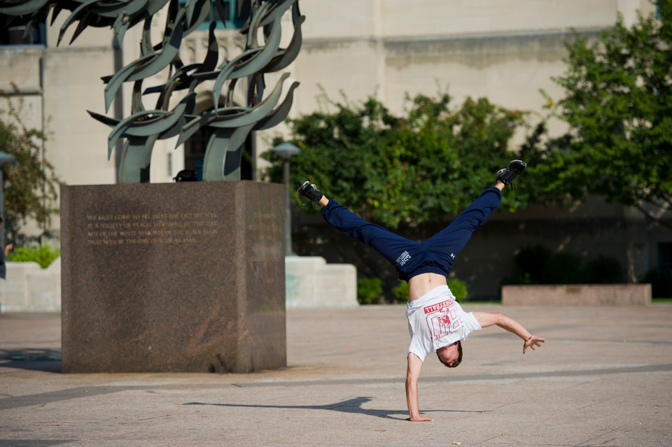  Corey Kronman (ENG'13) who is a member of the BU Free Running and Parkour Club works out in Marsh Plaza.&nbsp;  Photo by Cydney Scott for Boston University 