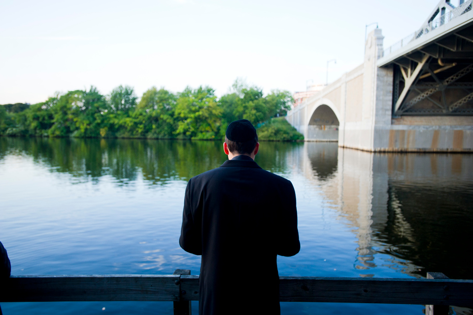  Justin Wiemer (SMG,COM'13) observes a solitary moment for himself along the Charles River during Hillel House's observance of Tashlich Monday September 17, 2012. Tashlich often observed during Rosh HaShanah. "Tashlich" means "casting off" in Hebrew 