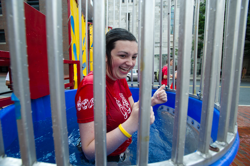  Rachel Power (CAS'14) makes the plunge for the Deaf Studies Club during BU's Comm Ave Fair September 7, 2012.&nbsp;  Photo by Cydney Scott for Boston University 