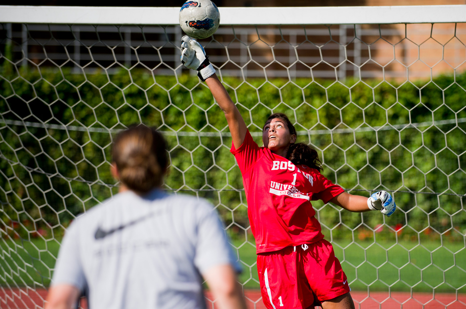  Ali Parisi (CAS'15), number 0, and Sarah Carrick (CAS'16), number 01, during pre-season camp for BU Women's soccer at Nickerson Field. The team's first game is August 17.&nbsp;  Photo by Cydney Scott for Boston University Photography 