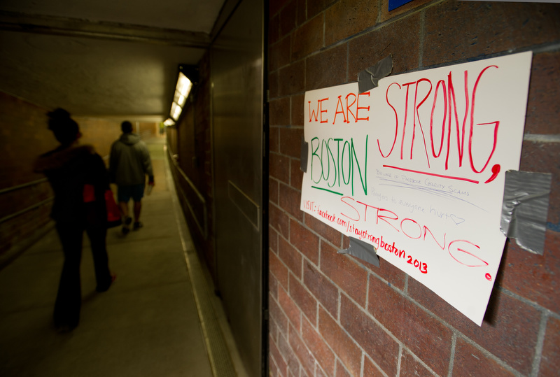  A hand-made sign promotes a fund-raising Facebook page in the Kenmore Square T stop April 20, 2013. 