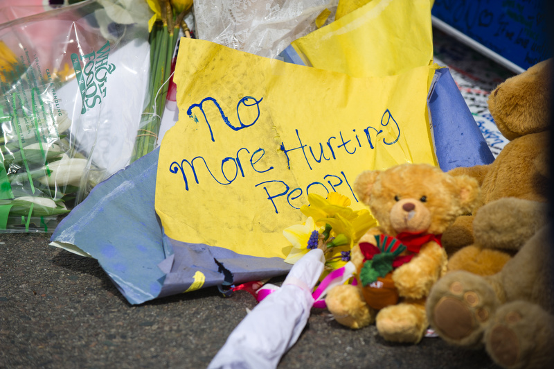  Scenes from the make-shift memorial by the barricades blocking off Boylston Street at Hereford Street April 20, 2013. 