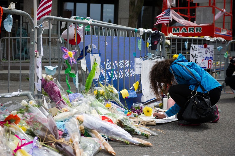  Scenes from the make-shift memorial by the barricades blocking off Boylston Street at Hereford Street April 20, 2013. 