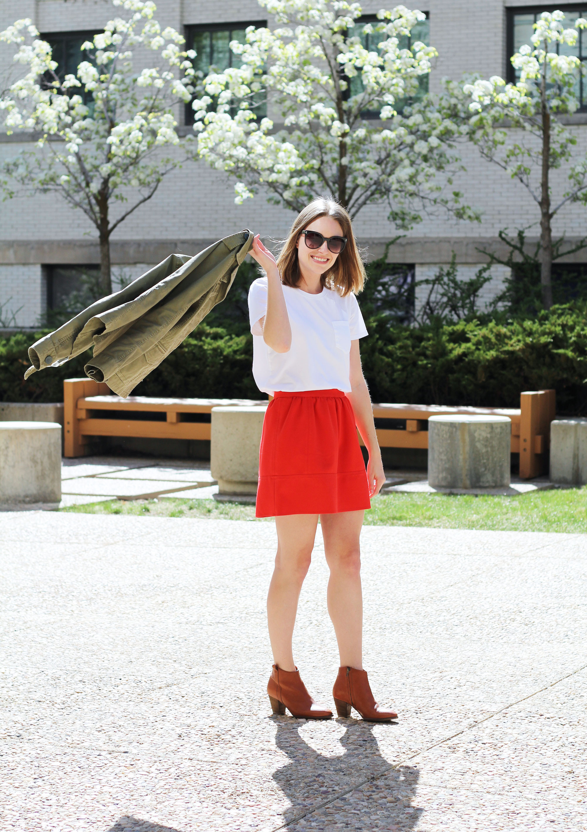 Spring grad school outfit idea with a white tee, red mini skirt, and utility jacket | Cotton Cashmere Cat Hair