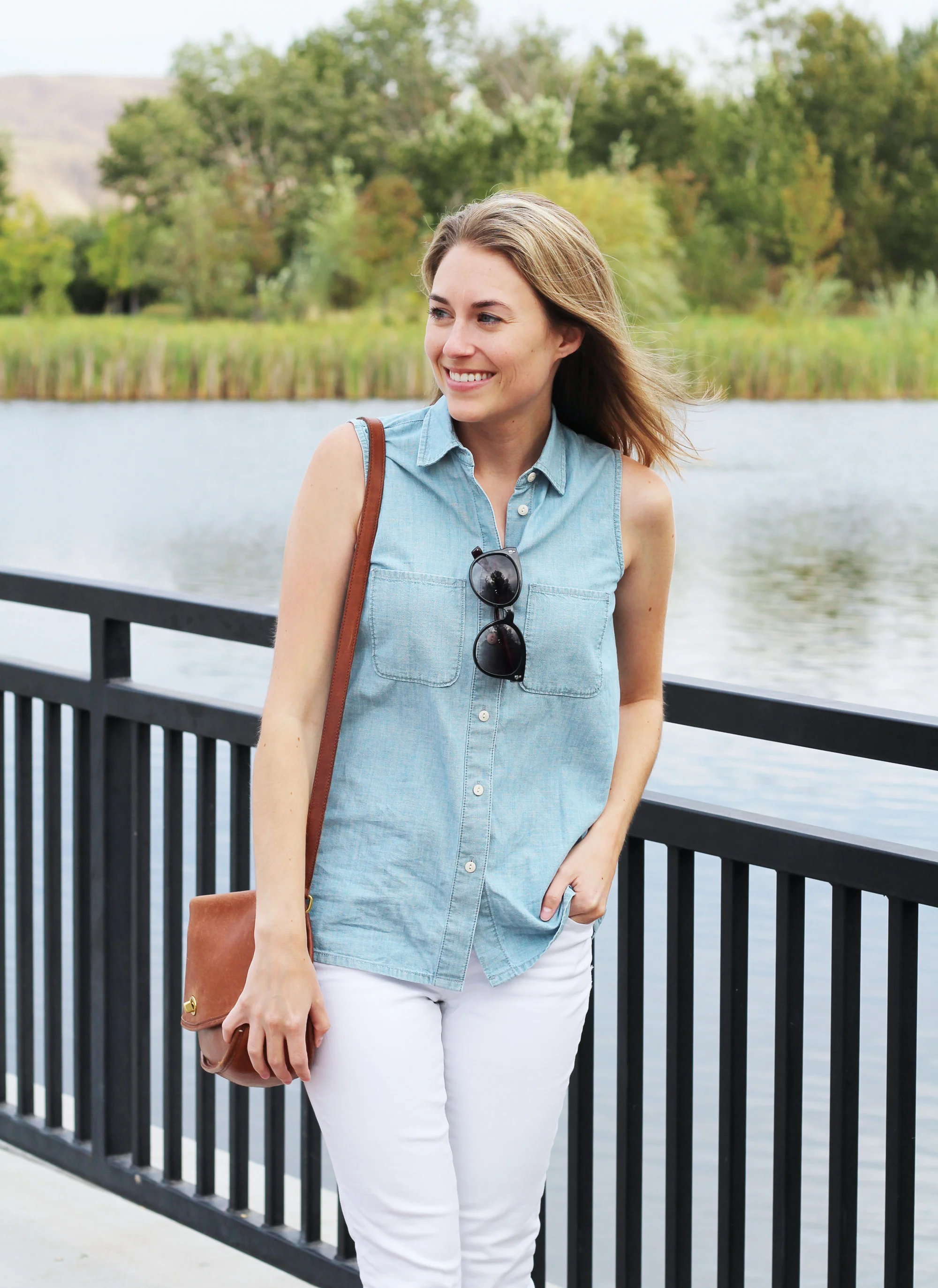 Sleeveless chambray shirt outfit with white jeans and Coach 'City' bag — Cotton Cashmere Cat Hair