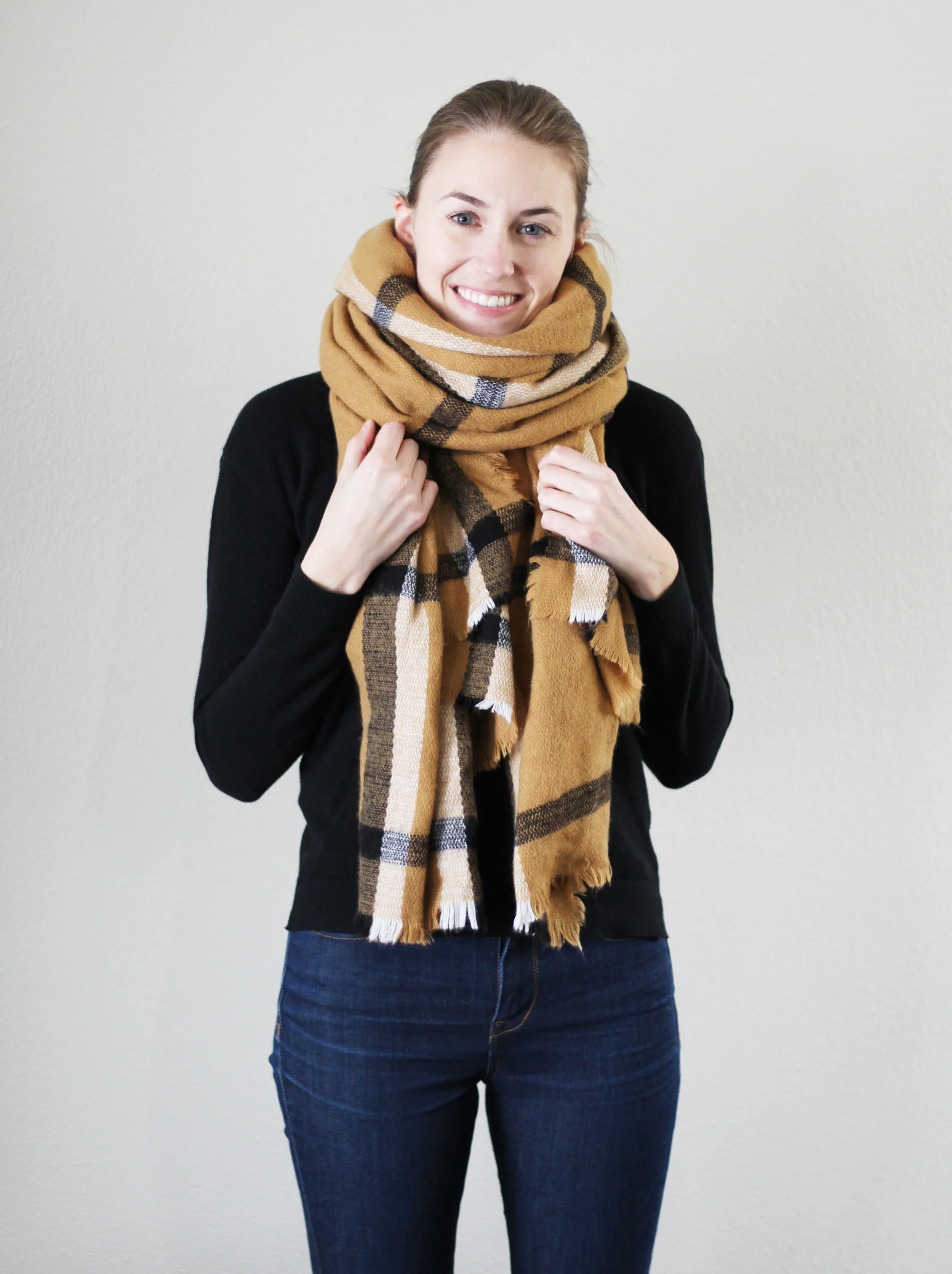 Plaid camel blanket scarf outfit with black sweater and skinny jeans — Cotton Cashmere Cat Hair