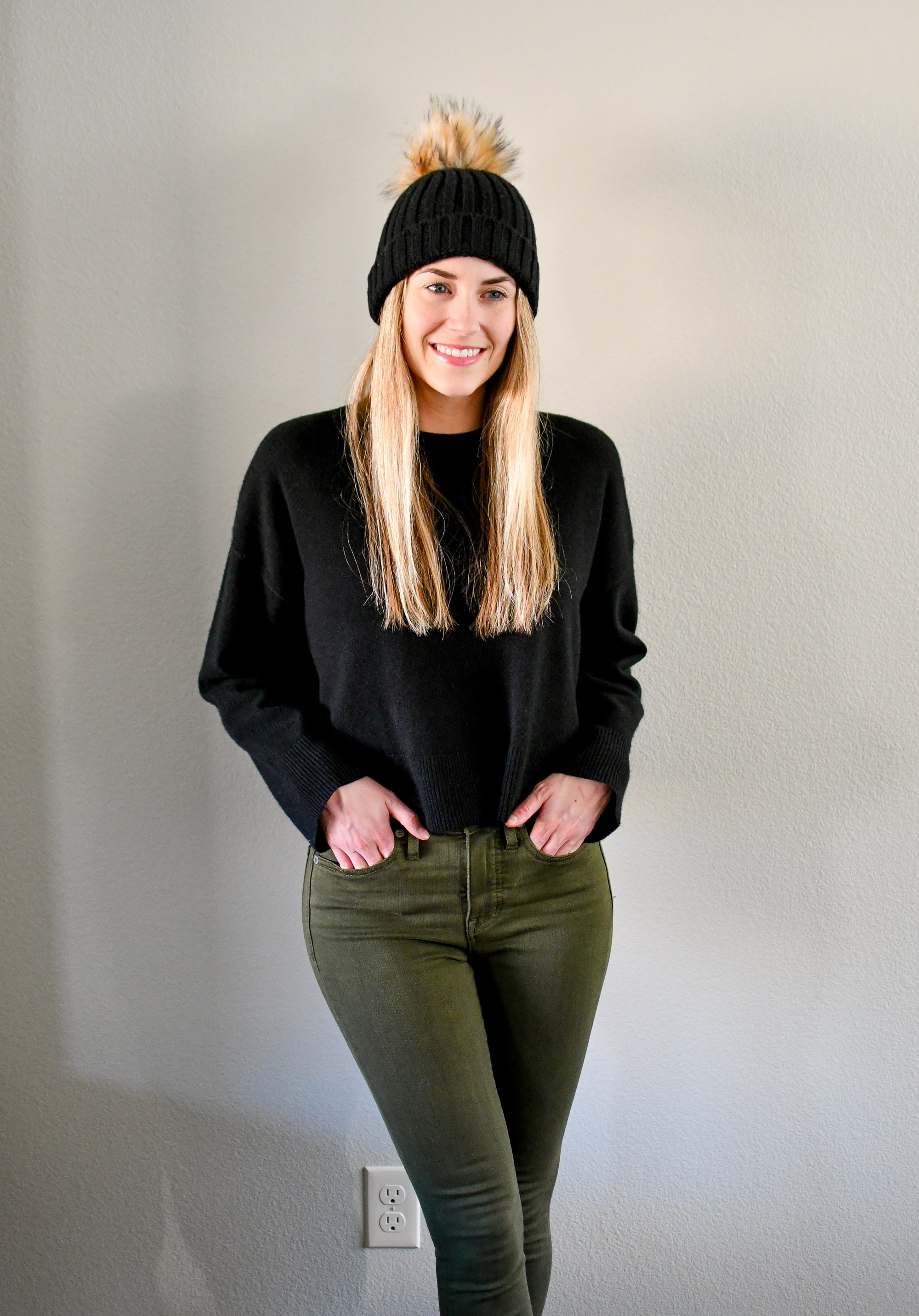 Black cropped cashmere sweater outfit with black beanie and olive jeans — Cotton Cashmere Cat Hair