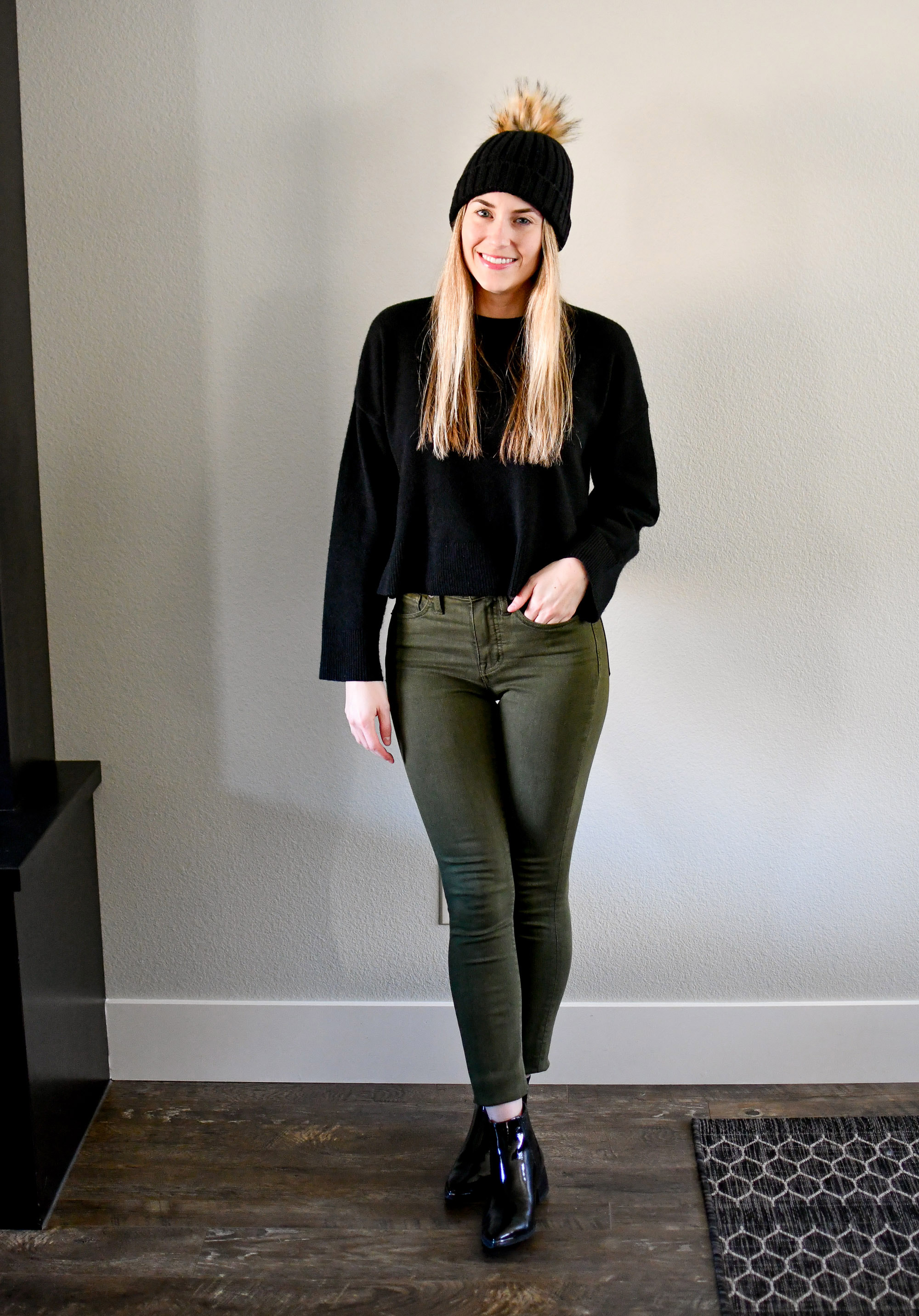 Casual winter outfit with black cropped sweater and olive green jeans — Cotton Cashmere Cat Hair