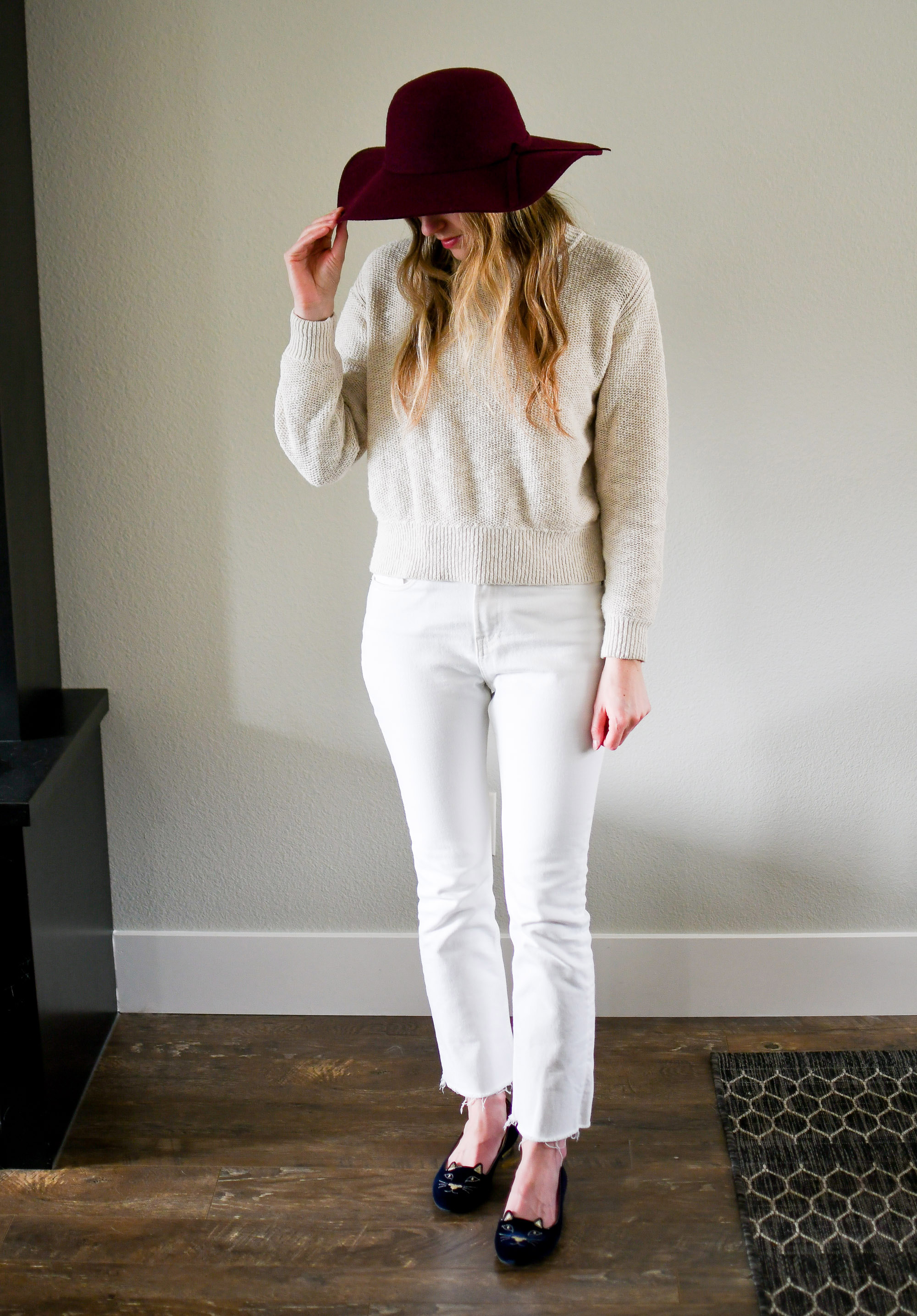 Burgundy hat, beige sweater, white denim, navy Kitty flats — Cotton Cashmere Cat Hair