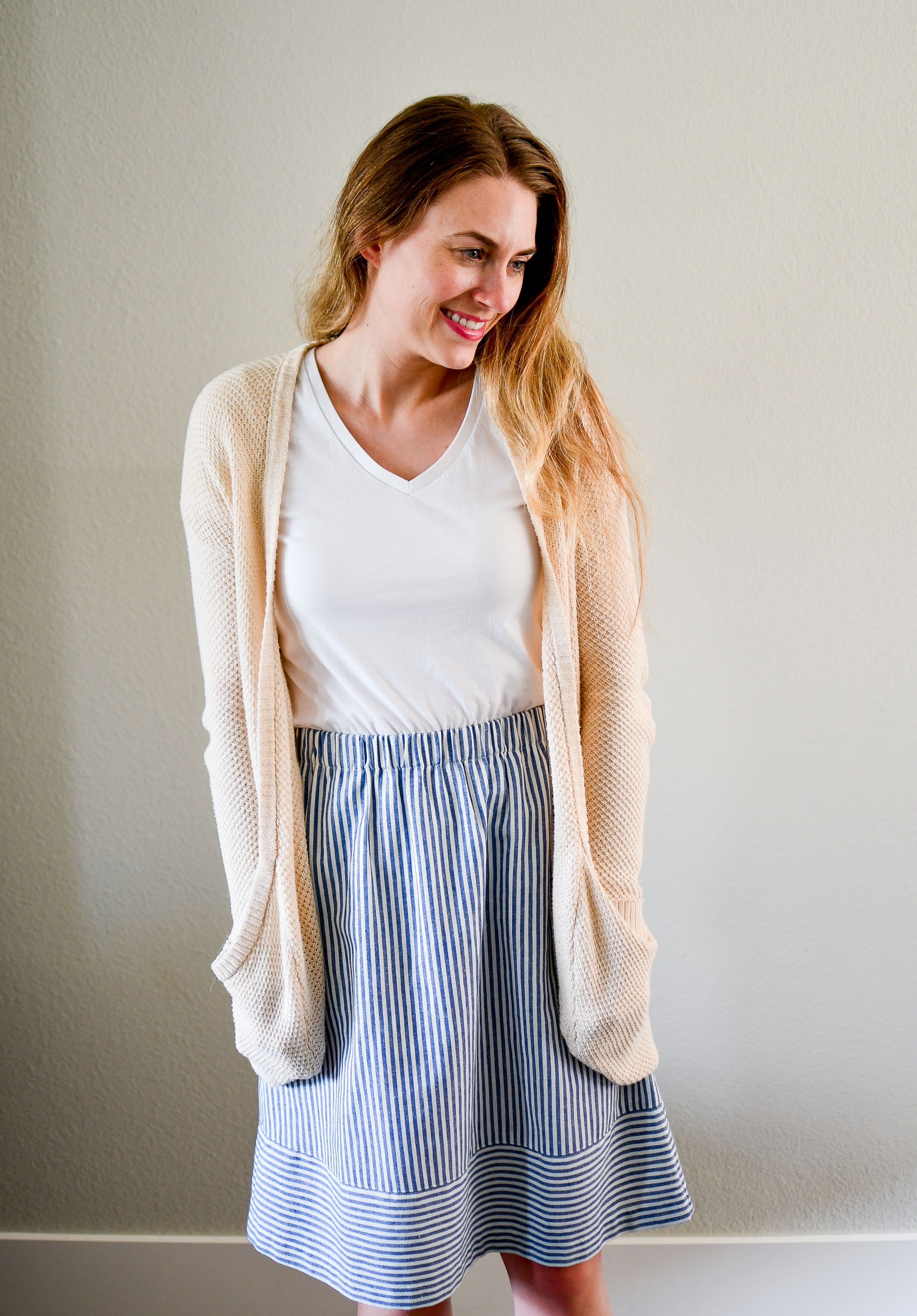 Cream cardigan, white tee, blue striped skirt summer work outfit — Cotton Cashmere Cat Hair