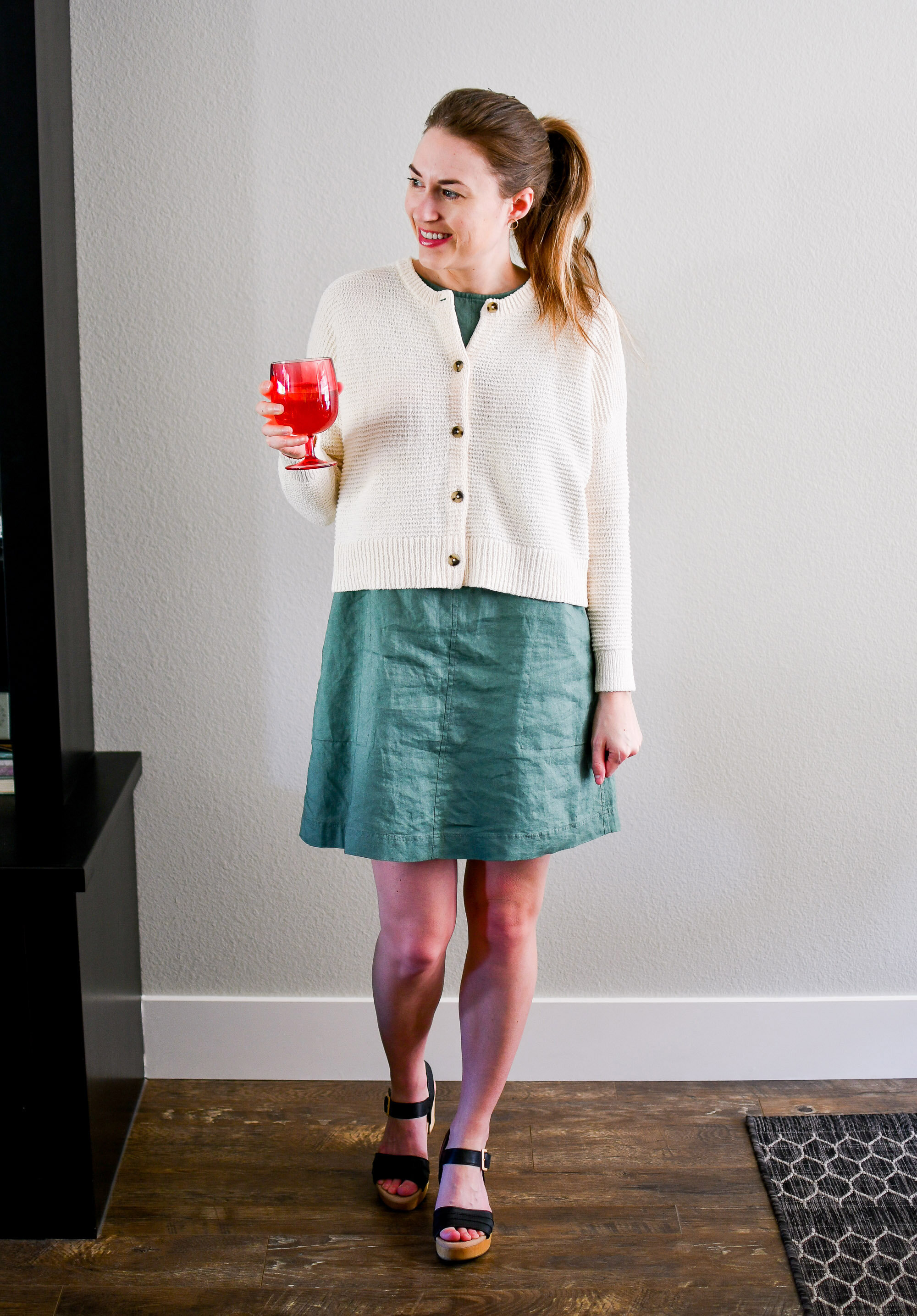 Casual spring weekend outfit with a cream cardigan layered over a green linen shift dress — Cotton Cashmere Cat Hair