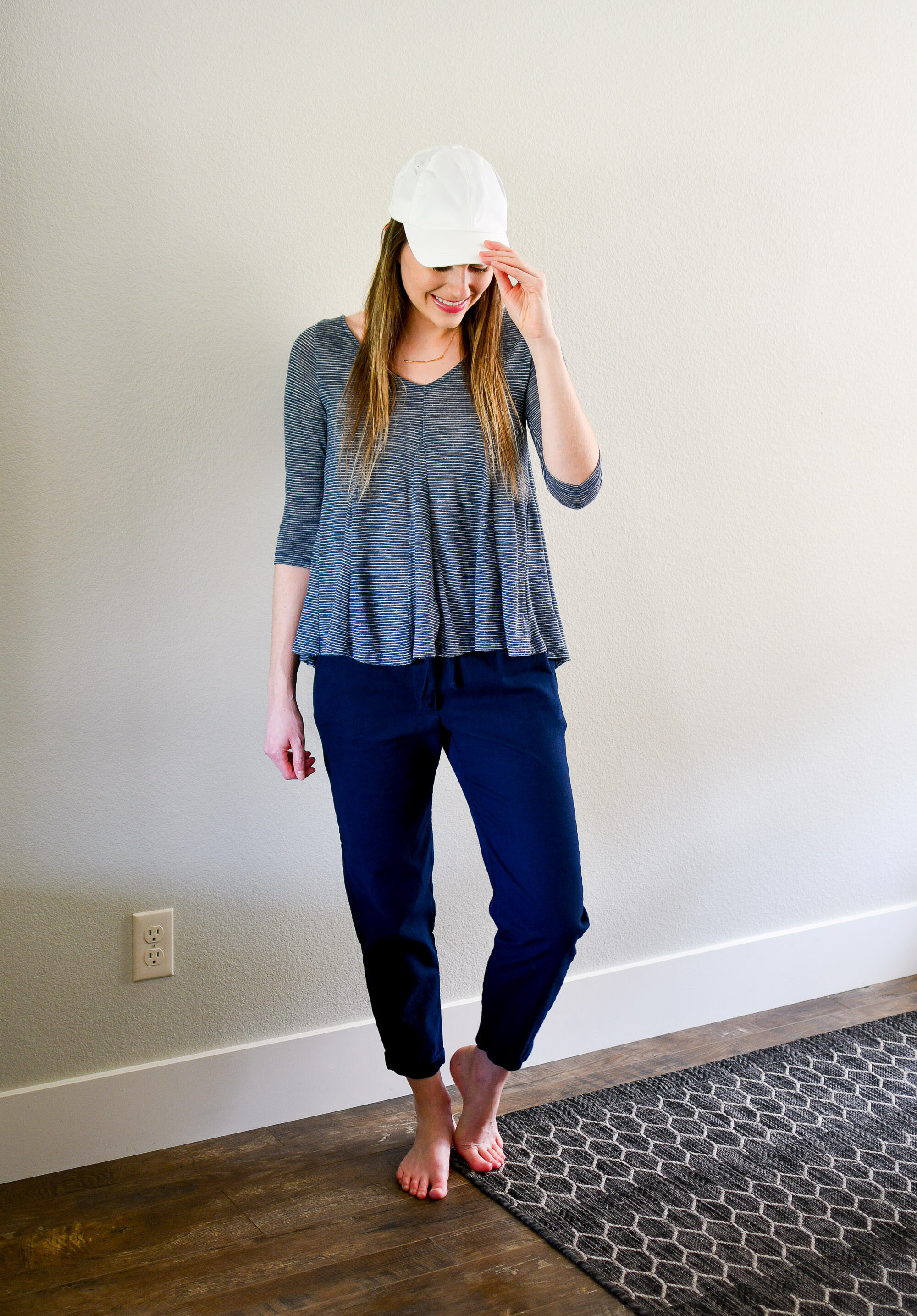Casual spring work from home outfit with white baseball cap, swing top, navy linen pants — Cotton Cashmere Cat Hair