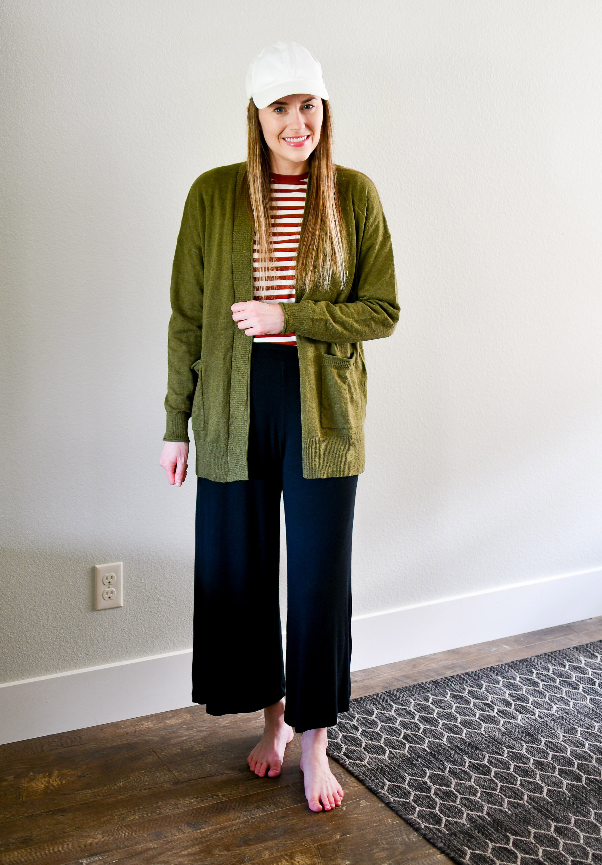 Spring work from home outfit with green cardigan, striped tee, wide leg pants, white hat — Cotton Cashmere Cat Hair