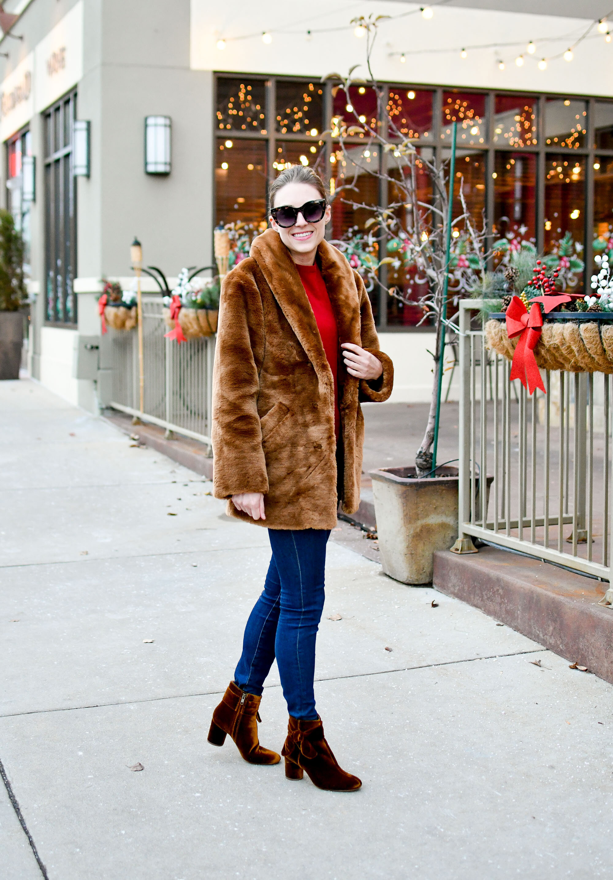 Holiday outfit idea: faux fur coat, red cashmere sweater, skinny jeans, velvet ankle boots — Cotton Cashmere Cat Hair