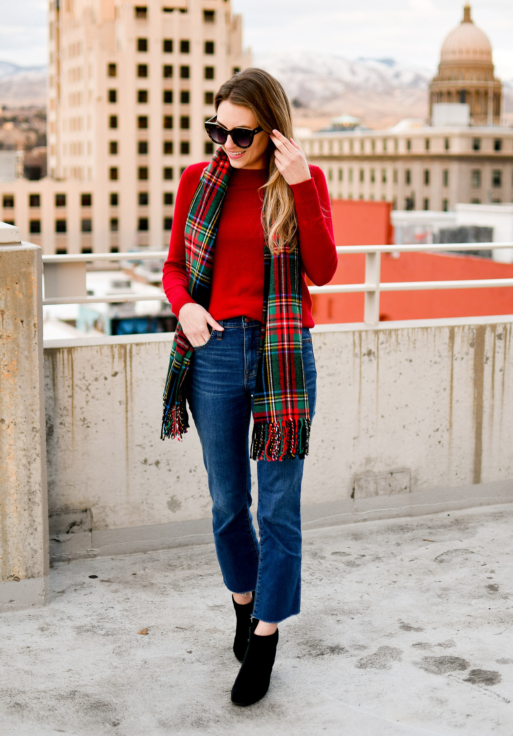 Holiday outfit idea: red cashmere sweater, demi-boot jeans, black velvet ankle boots, black red tartan scarf — Cotton Cashmere Cat Hair