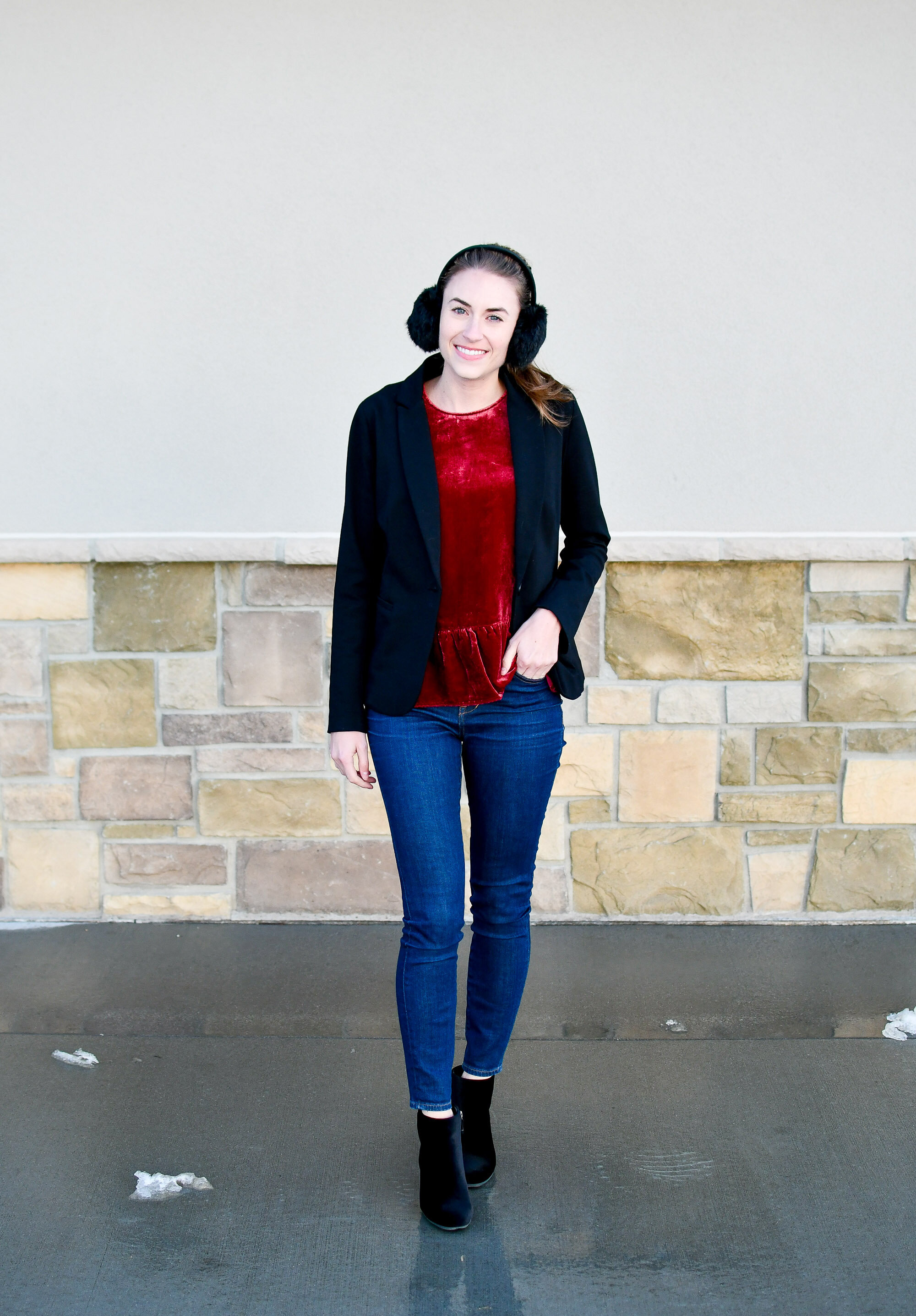 Holiday outfit idea: faux fur ear muffs, black blazer, berry red velvet peplum top, skinny jeans, black velvet ankle boots — Cotton Cashmere Cat Hair
