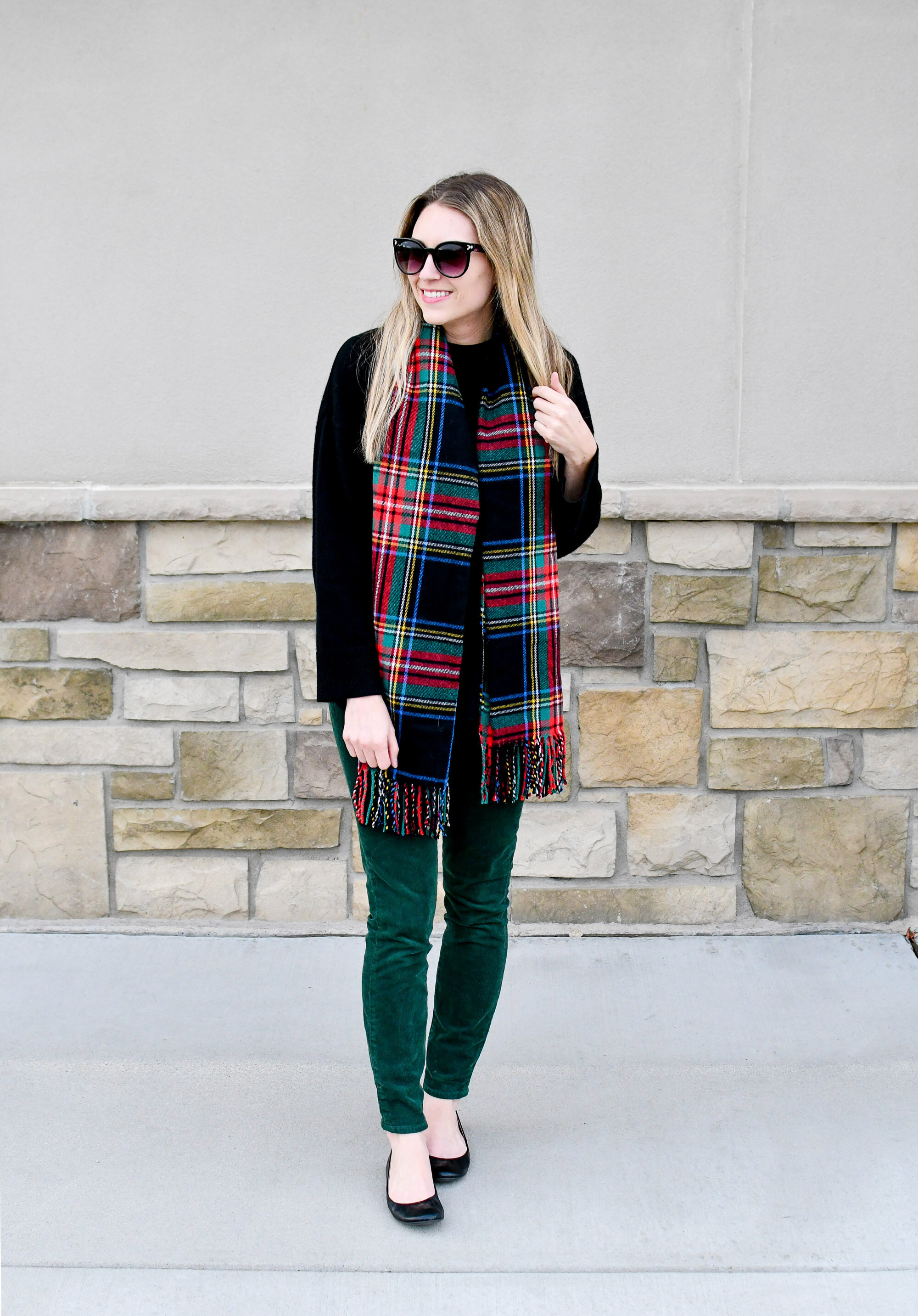 Holiday outfit idea: black cropped cashmere sweater, forest green corduroy pants, black ballet flats, black red tartan scarf — Cotton Cashmere Cat Hair