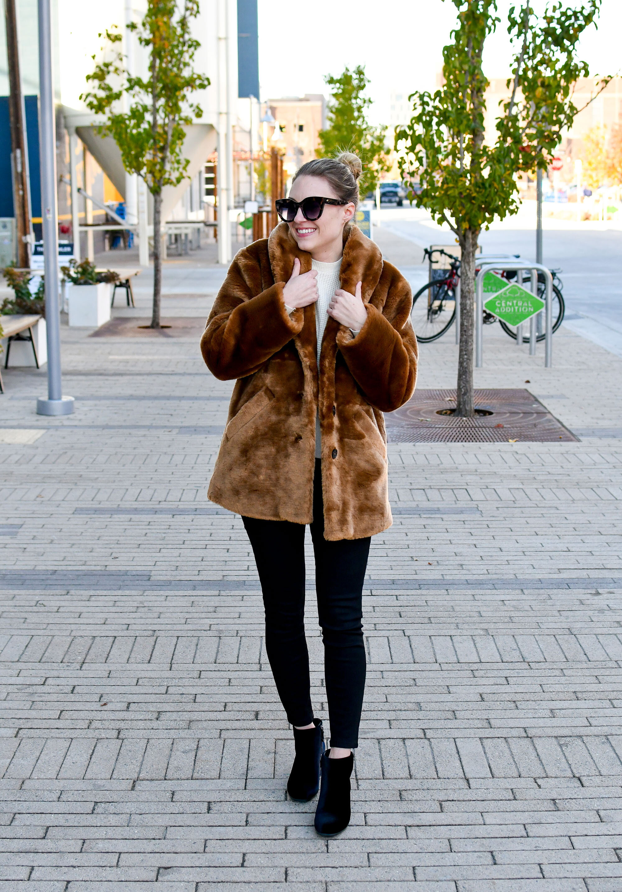 Holiday outfit idea: faux fur coat, ivory cashmere sweater, black skinny jeans, black velvet ankle boots — Cotton Cashmere Cat Hair