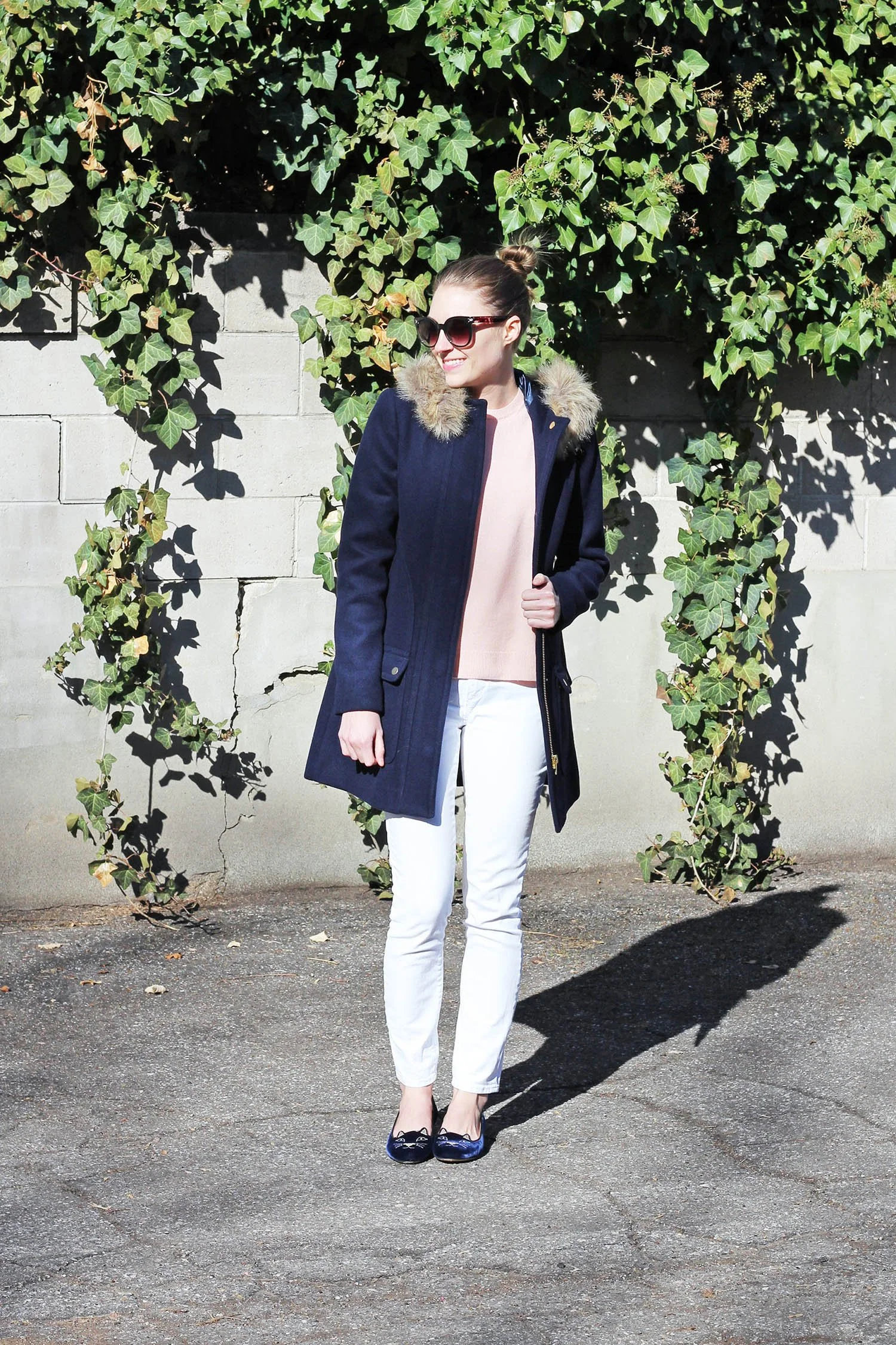 White Jeans Winter Outfit with navy coat, pink sweater, navy flats | Cotton Cashmere Cat Hair