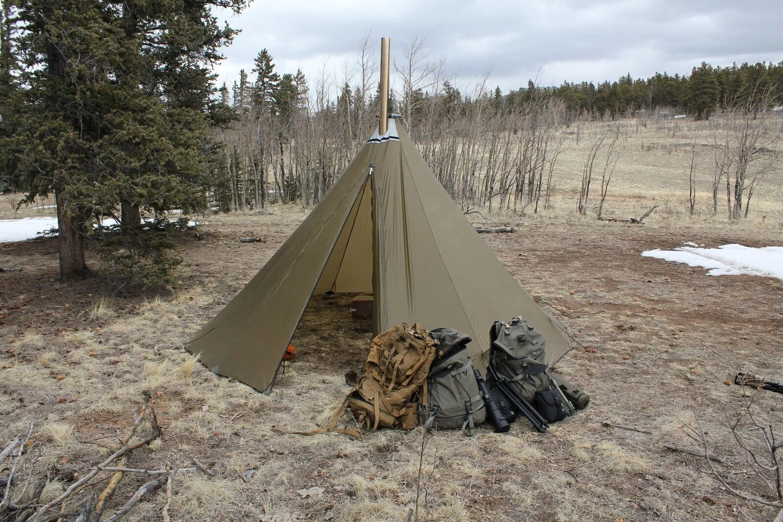 Pictured is an extremely high quality tipi tent available from Kifaru. http://kifaru.net/portfolio_page/tipis/