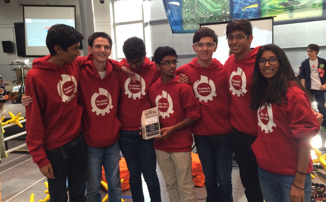 Team 765X is shown with the Judges Award, which is presented to a team based on their design (specifically their anti-tip and lift designs) as well as each member having specialized knowledge on each part of the robot.