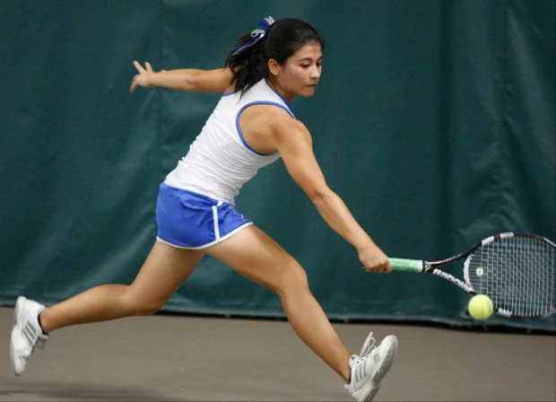 Rita Vought uses her strong backhand to return a shot.