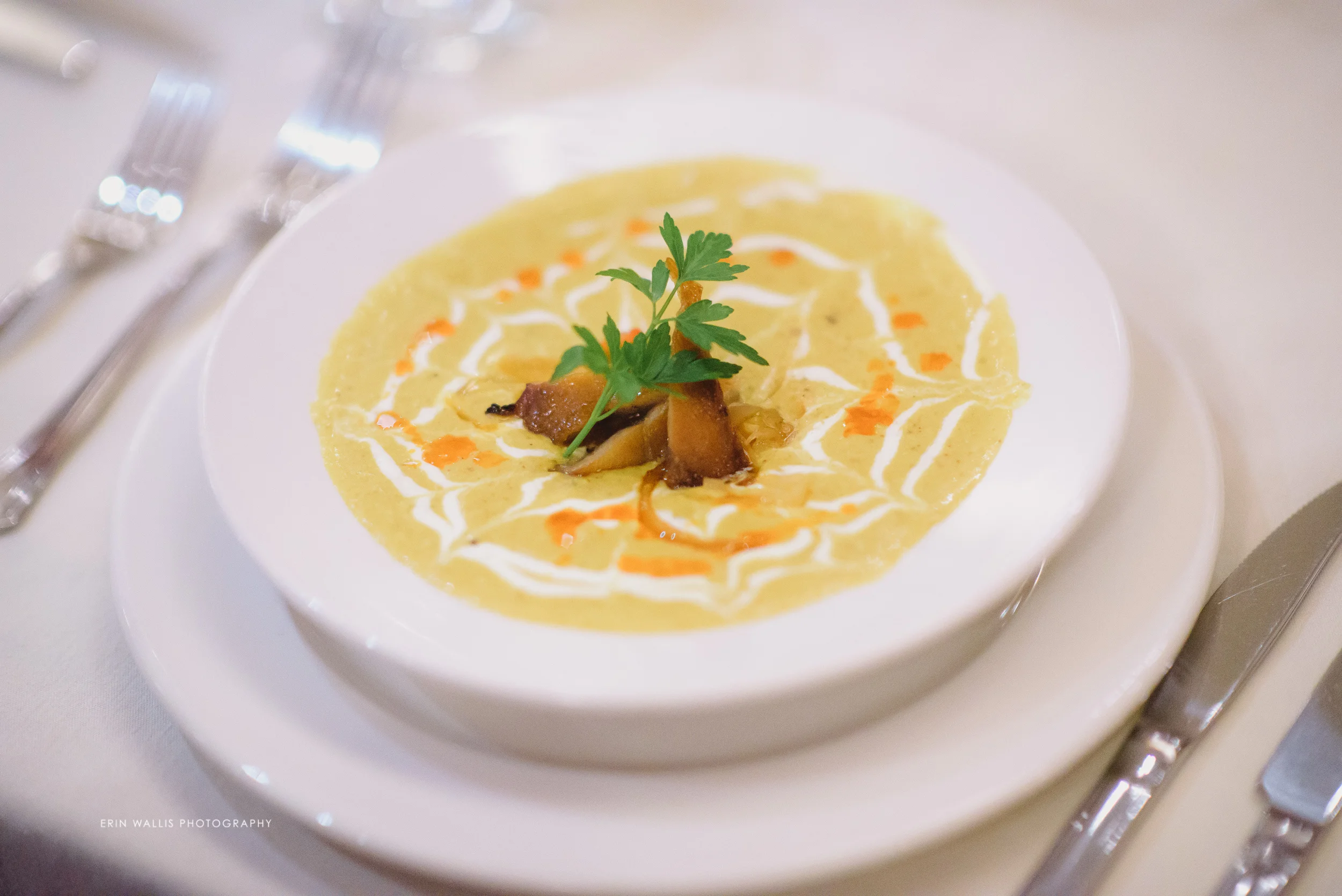 Yellow madras coconut curried corn bisque, melted leek & bell pepper fondue, Fleurer's hot smoked sable fish, creme fraiche & chili oil.