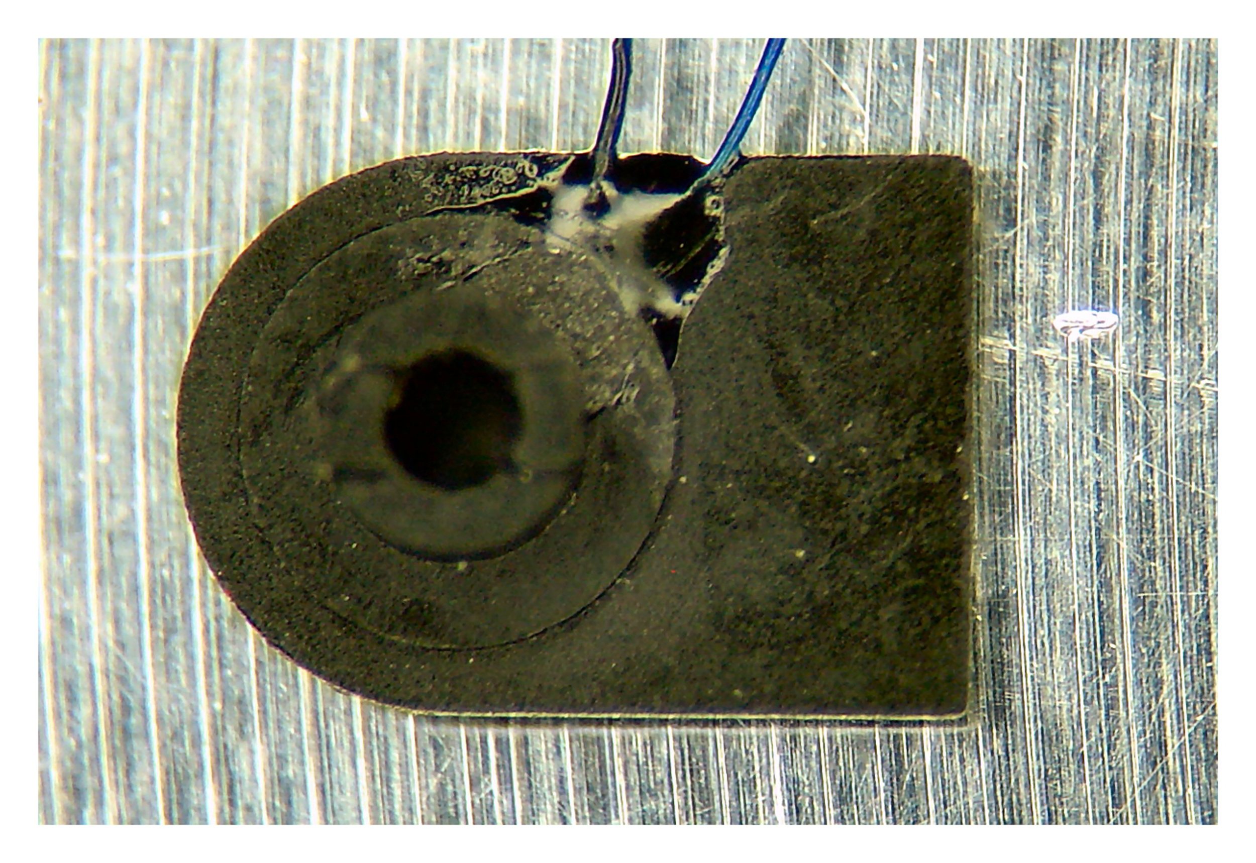 Micro Thermocouple Embedded in Glass Filled Laparoscopic Device Jaw Pivot Component