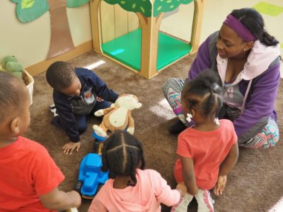 Teacher Dasheena Moore practices the 14 Talking Tips with children in her classroom. “The tips have helped me get my kids talking more by following their lead and paying attention to what they’re interested in,” she said.