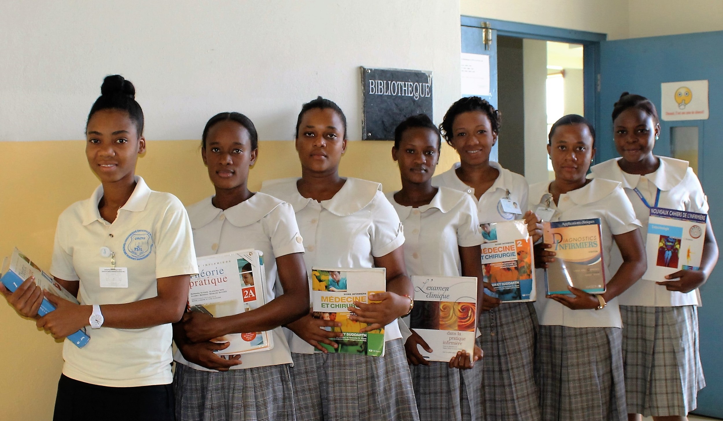 Students with Textbooks from AA Rotary Grant