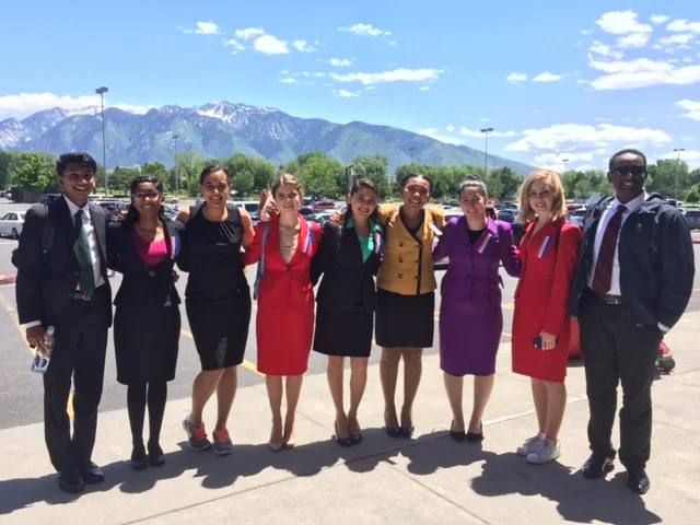 Our beautiful speech competitors with an entrancing backdrop at Brighton High School.