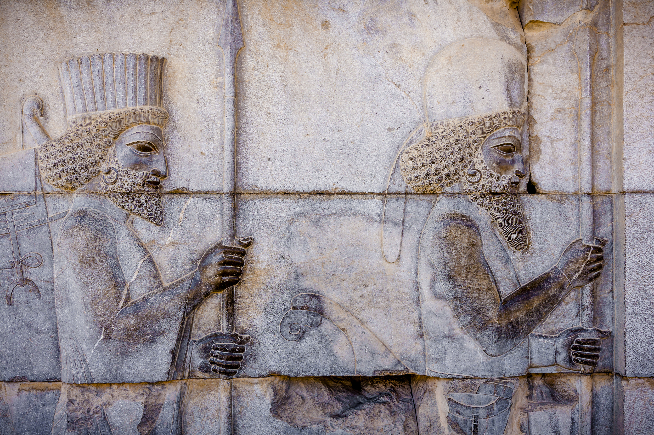Persian soldiers on the Staircase of All Nations at Persepolis, Iran. These ancient carvings were protected from damage by being buried.