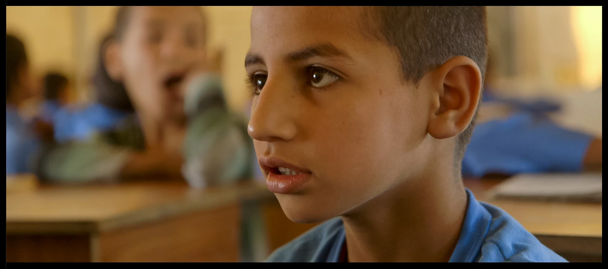 Film still: Yaldash, the youngest of three brothers we follow in Angels Are Made Of Light