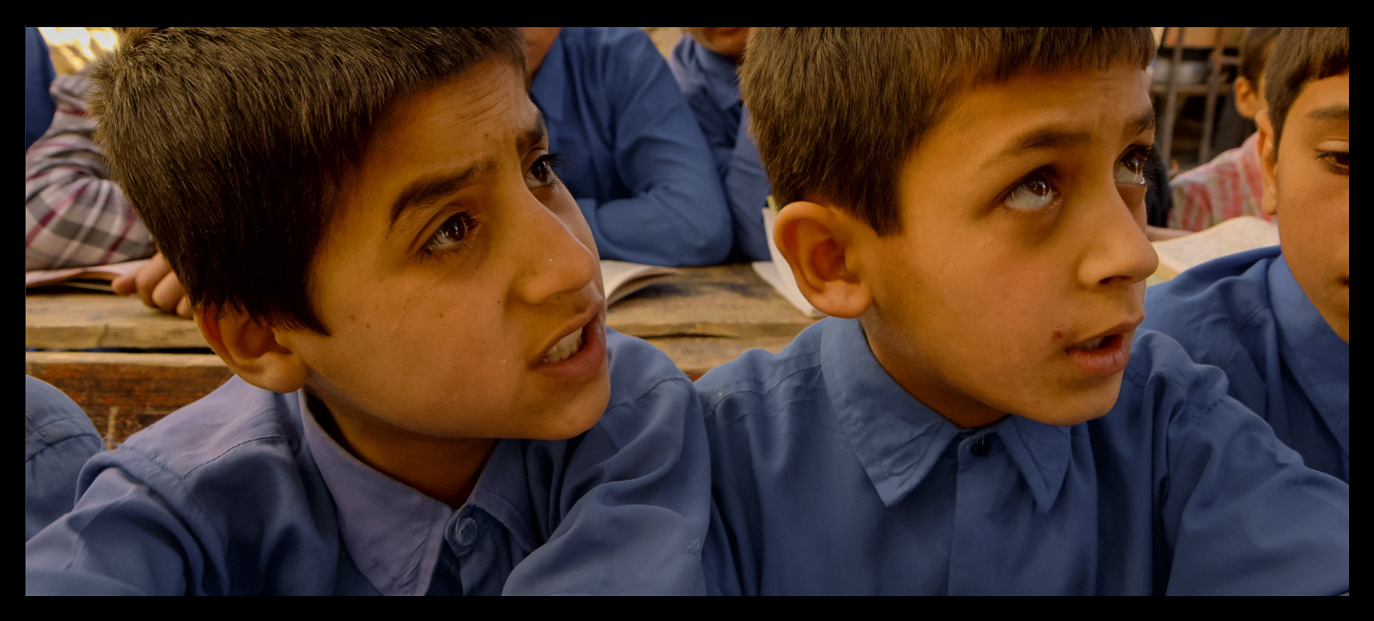 Film still: Sohrab (left) during a classroom scene filmed for Angels Are Made Of Light