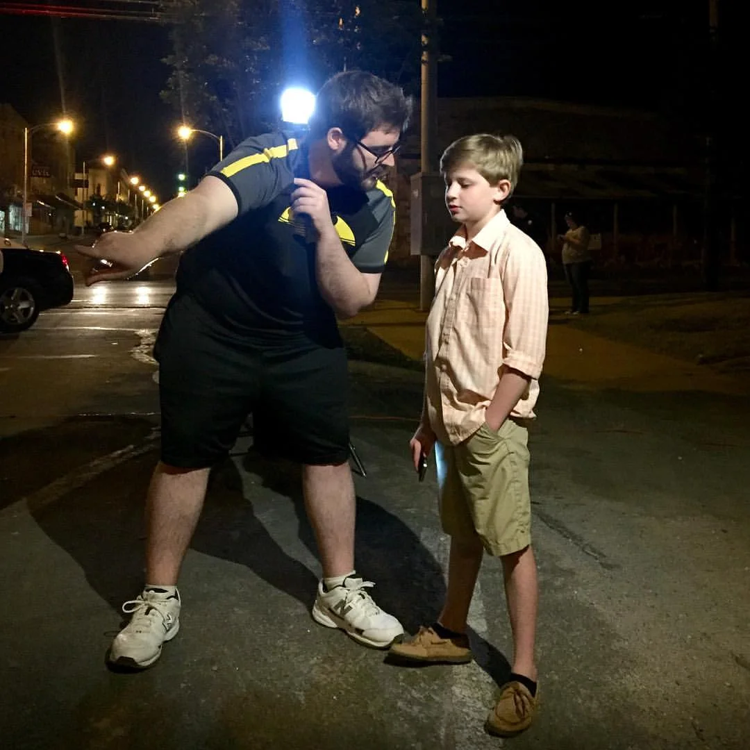 Director Donavon Thompson discusses the first scene with actor Corbin Pitts.