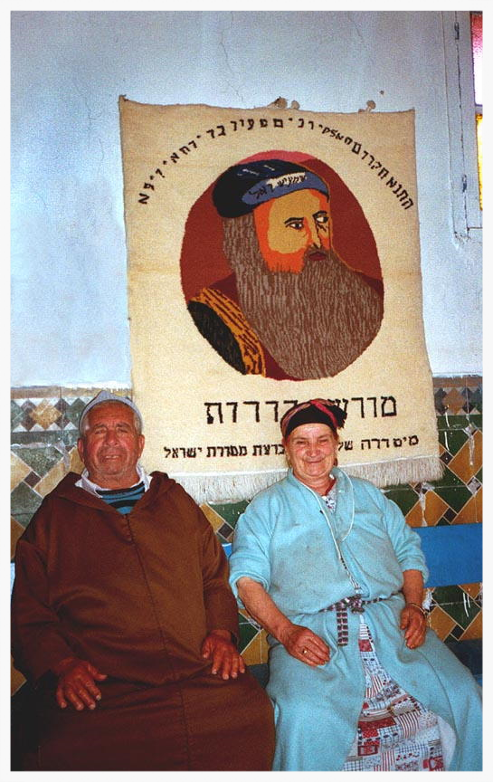 Yamna and Hananiyah Elfassies told the story of why they stayed in the Ourika Valley. They remained in the Ourika Valley to protect the tomb of Rabbi Shlomo ben Hensh, decades after all the other Jews left. Rabbi ben Hensh died more than 500 years ago, but they revered him as a Tzadik who lived after death, stopped the sun's course, and even turned into a snake to ensure himself a proper Jewish burial. Because of a recurring dream they shared, in which a snake became a staff blocking their path, the Elfassies were afraid to leave the gravesite. The Tzadik's tomb is said to be the source of miracles.