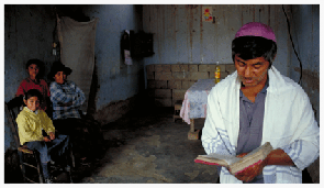 Jose Urquiza prays in Hebrew at home in Milagros, a particularly impoverished section of Trujillo, Peru, while his family watches. The Urquizas are among the last remaining practitioners of Judaism in Milagros, the former neighborhood of Segundo Villanueva, whose charismatic leadership began the Peruvians’ movement toward Judaism. Jose Urquiza, who taught himself to read Hebrew using an Aleph-Bet chart, has practiced Judaism for more than ten years with his family. Yet, they were passed over for conversion by the Beit Din which visited Trujillo in November 2001. Regarding the Urquizas present difficulties, Jose says, "We try to study the Torah and the Shulkhan Arukh (code of daily Jewish observance) day and night," referring to his careworn, photocopied versions of the texts. "The problem is, we need someone to teach us, because we cannot understand our responsibilities very well on our own."