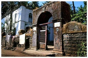 Though the pictured Alibag synagogue dates from 1848, some say that for at least 800 years, the Bene Israel have prayed to the Jewish G-d in this village, three hours south of Bombay on the palm-bedecked Konkan Coast. The benches creak and the air hangs heavy in the mildewed Magen Aboth sanctuary. Nonetheless, each day, the old community members gather for prayers, and on Shabbat collect a minyan from the 8-10 Jewish families left in town.
