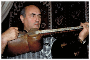 Nisim Nisimov is a world-renowned purveyor of Azeri and Mountain Jewish music, which share the same musical tones. Here, he plays an Azeri "muham" melody on his tar with words in Ju'uri, the unique Mountain Jewish language derived from Persian. He sings and plays centuries-old, contemporary and original compositions, about generations of families, mischievous children, unrequited passion between Jewish boys and Krasnaya Sloboda girls, and "Seeya Choomha," a black-eyed Jewish woman who falls in love. Nisim also directs a chorus of local boys, some of whom sing in festivals around the country.