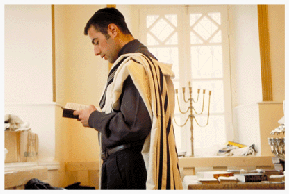 Krasnaya Sloboda's young men lead the community. At age 20, Elazar Nisimov had already taken his place among the village's oldest learned men. Having just returned from Shurut Ami yeshiva in Israel, where he became a certified shokhet (Jewish ritual slaughterer -- see photo/caption below), Elazar reads through the morning prayers in Hebrew like a native-born Israeli. Though he may eventually return to Israel, for now, his talents are needed in his village, where he is admired both by the younger boys and the older men. The latter grew up during the Communist era, when Jewish learning like that which Elazar received was strictly prohibited.