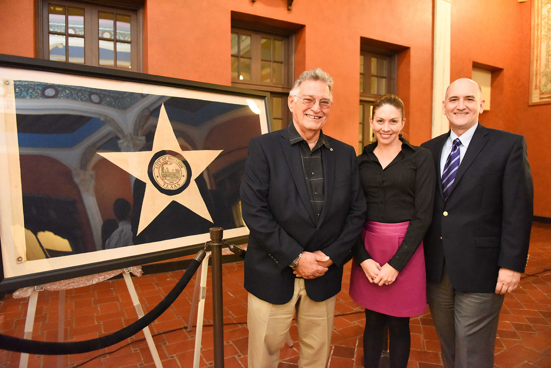  (from left) Frank Descant, who donated the flag to Preservation Houston; Houston Metropolitan Research Center Director Laney McAdow; PH Acting Executive Director David Bush /  photo by Daniel Ortiz  