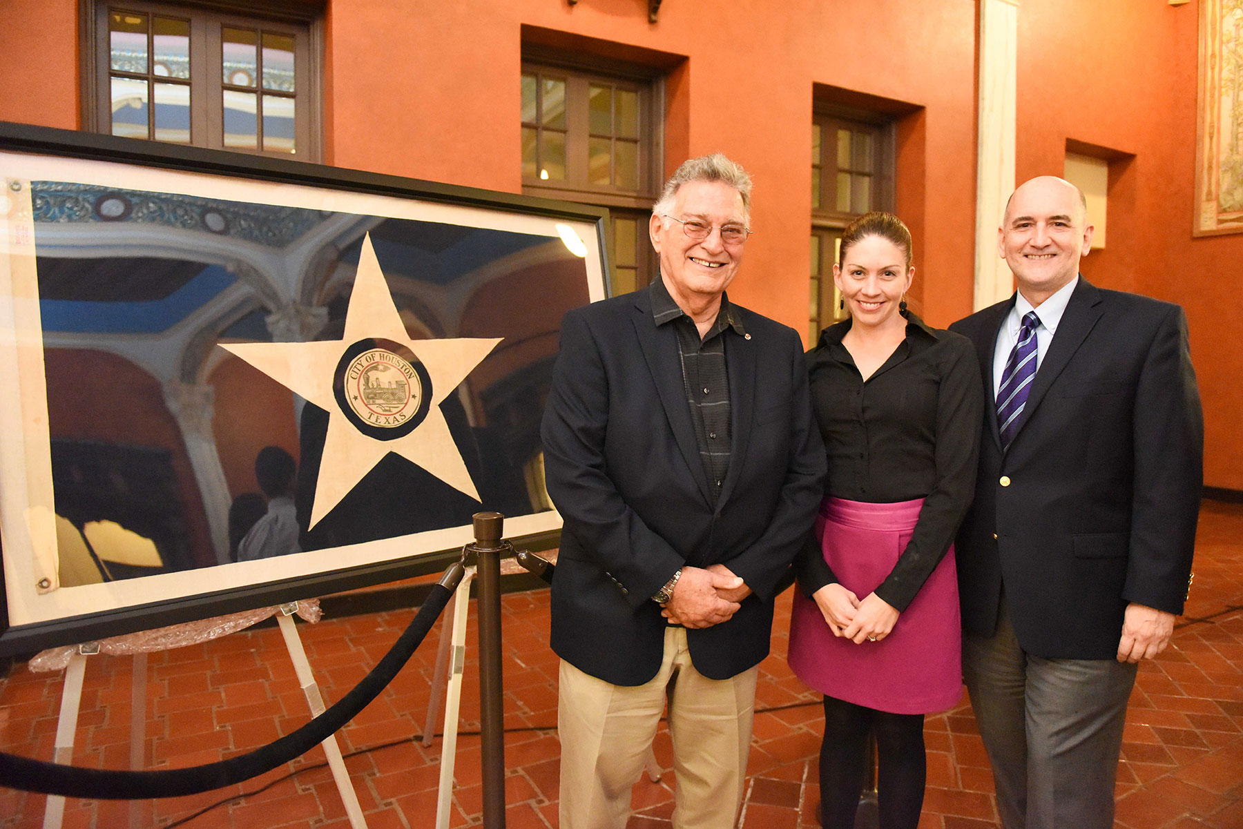 (from left) Frank Descant, who donated the flag to Preservation Houston; Houston Metropolitan Research Center Director Laney McAdow; PH Acting Executive Director David Bush / photo by Daniel Ortiz