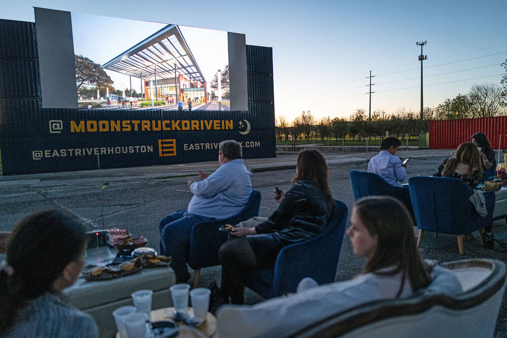  Guests in box seating watch the 2021 Good Brick Awards presentation on the big screen /  photo by Daniel Ortiz  