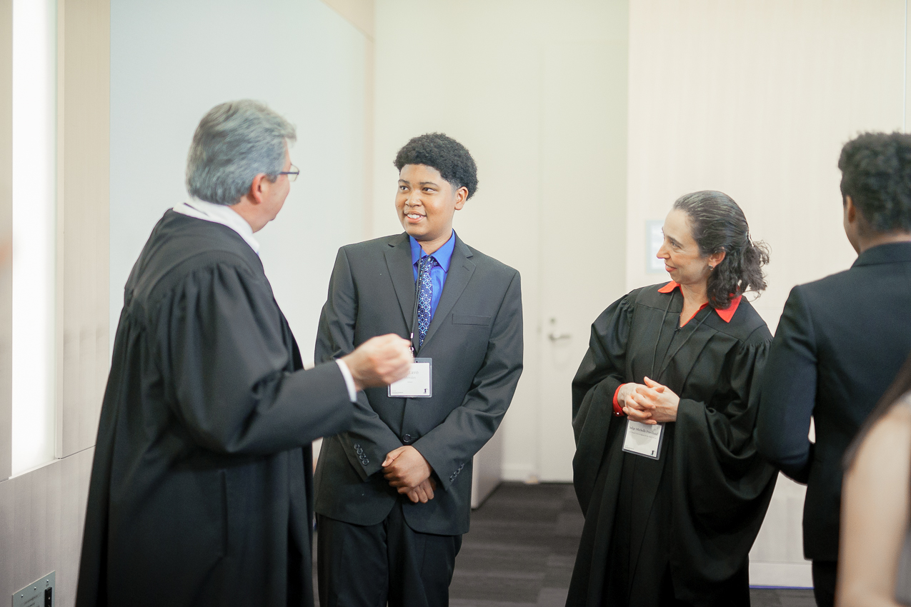 Moot Court Debater Gustavo receiving feedback from the Judges